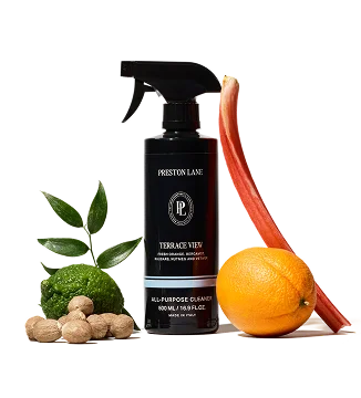 Preston Lane all-purpose cleaner bottle with rhubarb, orange, and lime on a white background